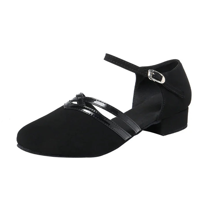 Black suede low heel shoe with ankle strap and glossy crisscross detailing