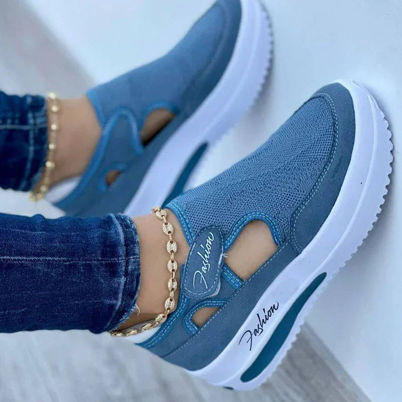 Blue mesh and suede slip-on sneakers with white thick sole and gold ankle bracelet on model wearing dark jeans