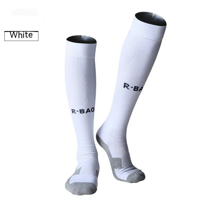 White knee-high athletic socks with gray toes and R-BAO logo on a plain background