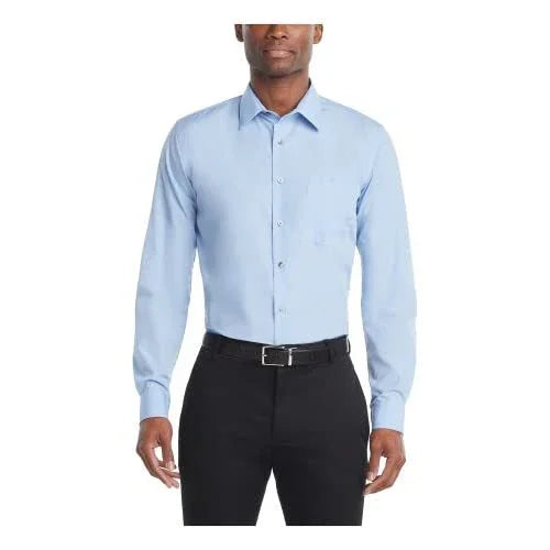 Men's light blue dress shirt with long sleeves paired with black pants and black belt on model
