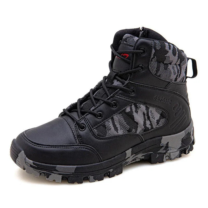 Black and grey camo tactical boot with rugged sole and lace-up design on white background