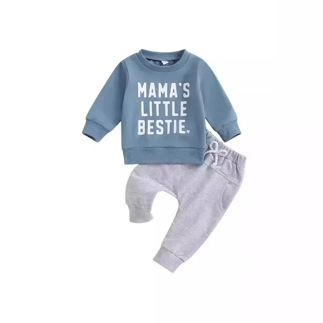 Blue toddler sweatshirt with "Mama's Little Bestie" text paired with gray pants outfit