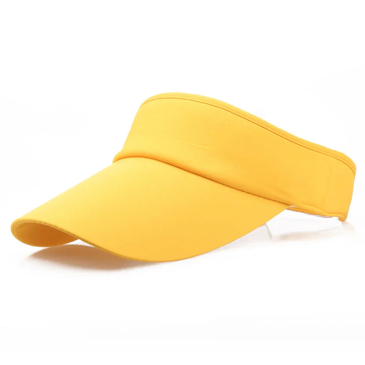 Bright yellow sports sun visor cap isolated on white background