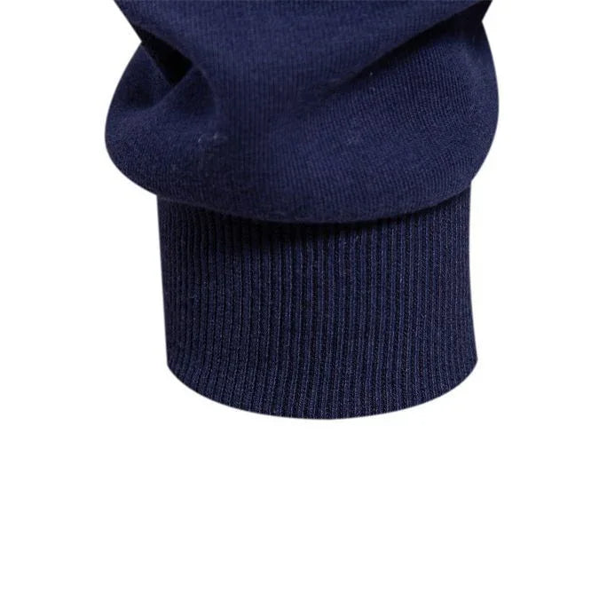 Close-up of navy blue ribbed cuff on a sweatshirt sleeve