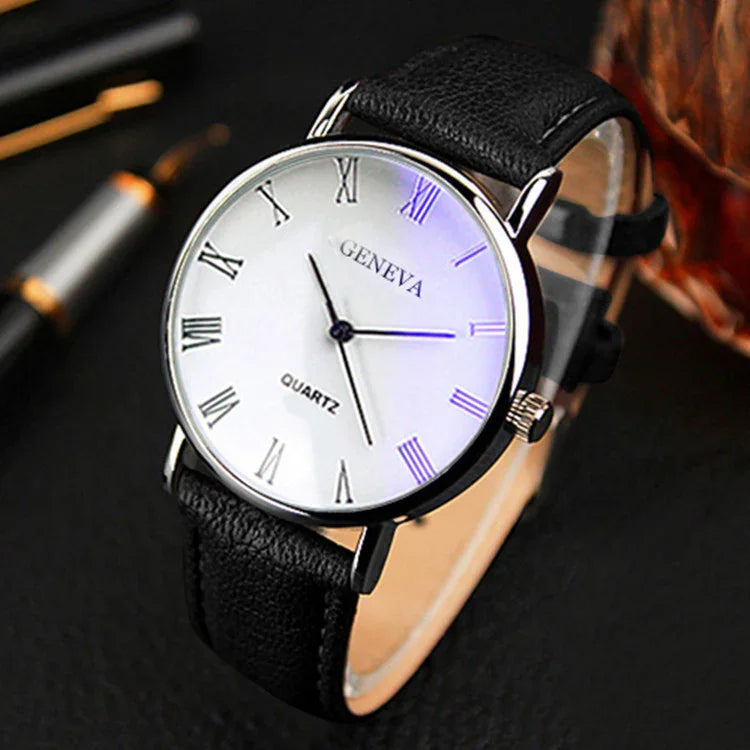 Classic Geneva quartz wristwatch with white dial, black Roman numerals, and black leather strap