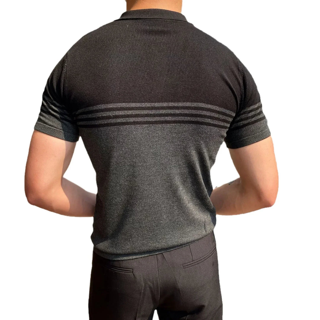 Back view of man wearing short-sleeve black and gray knit polo shirt with stripes