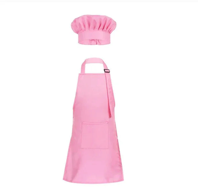 Pink chef hat and matching adjustable apron with front pocket on white background