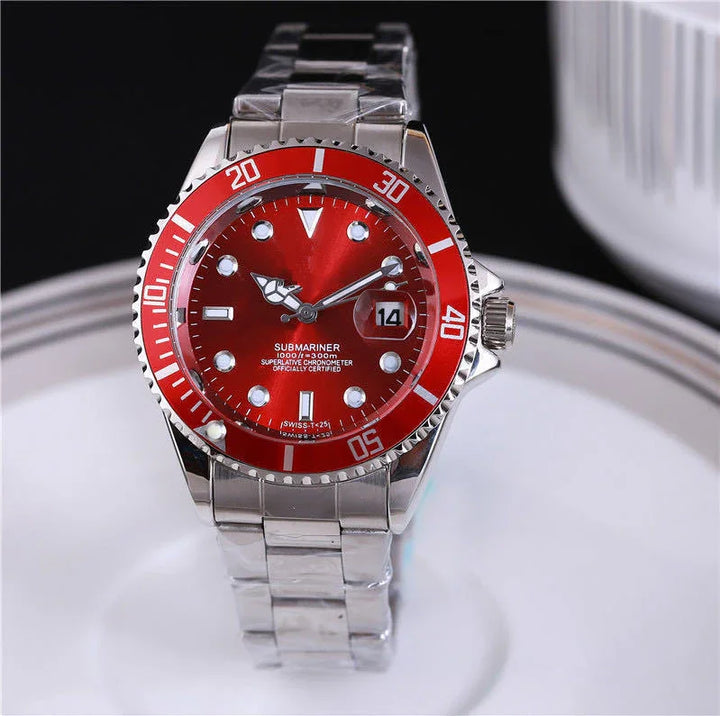 Silver Submariner watch with red bezel and dial, stainless steel bracelet, and date display
