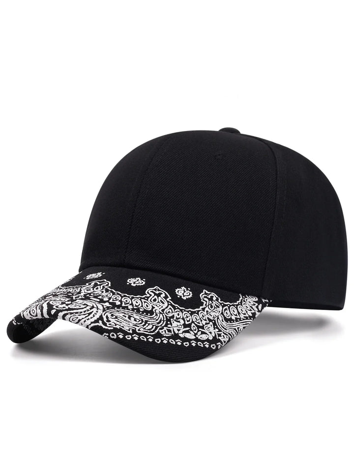 Black baseball cap with white paisley bandana print on the curved brim