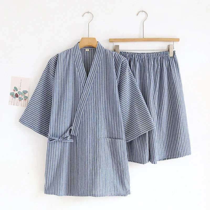 Blue and white striped kimono-style top and matching shorts set hanging on wooden hangers