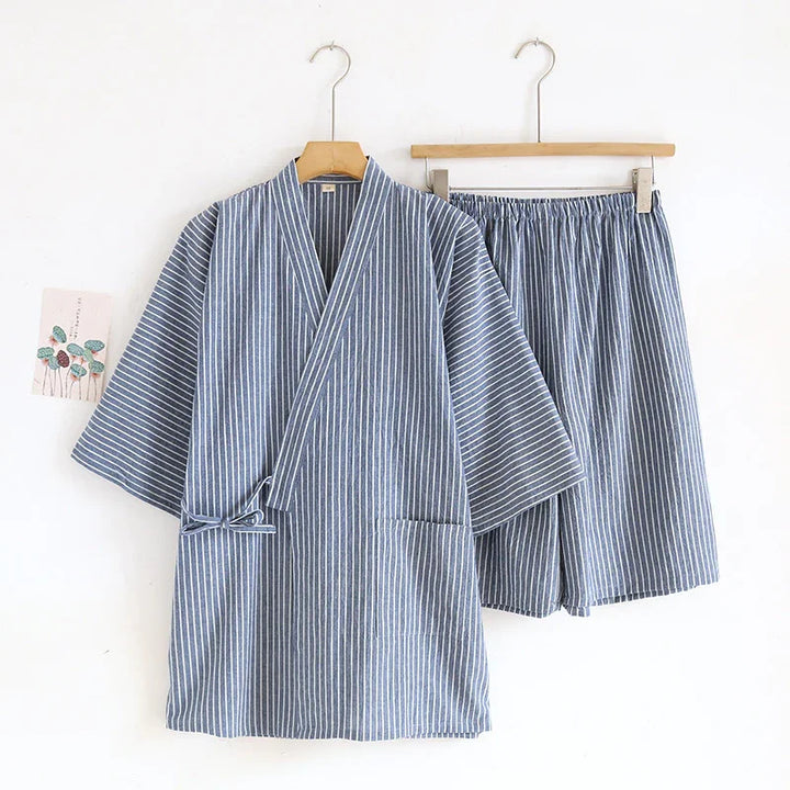 Blue and white striped kimono-style top and matching shorts set hanging on wooden hangers