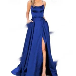 Elegant blue satin evening gown with spaghetti straps and thigh-high slit on model