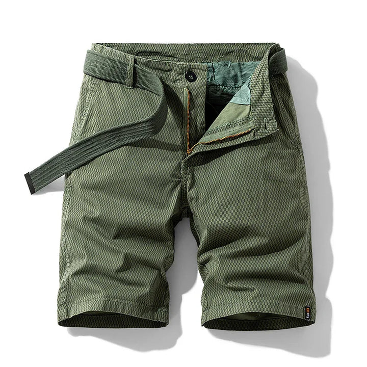 Men's green textured casual shorts with zipper fly and matching belt on white background