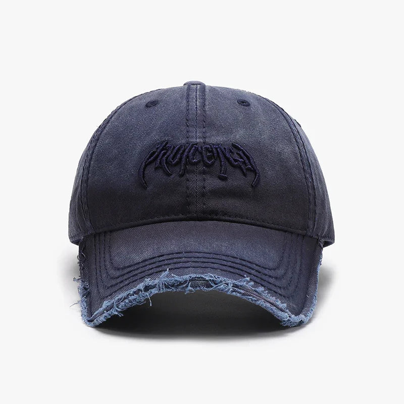Dark blue distressed baseball cap with curved brim and embroidered text on front