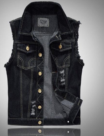 black sleeveless distressed denim vest with gold buttons and front pockets on gray background