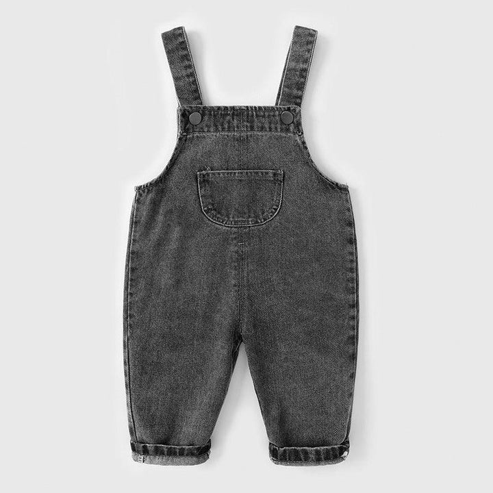 Black denim baby overalls with front pocket and adjustable straps on white background