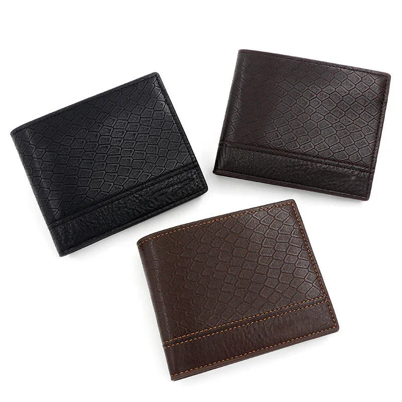 Three textured leather men's wallets in black, dark brown, and brown with stitching detail on white background