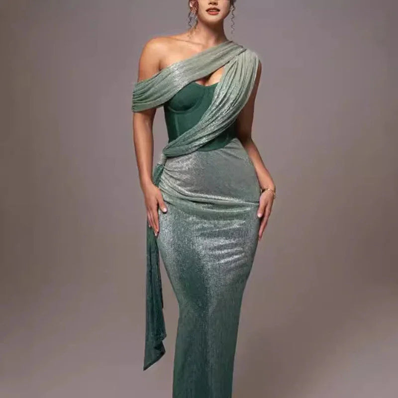 woman wearing elegant one-shoulder green velvet evening gown with draped sash