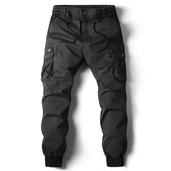 Black cargo jogger pants with elastic waistband, drawstrings, side pockets, and cuffed ankles