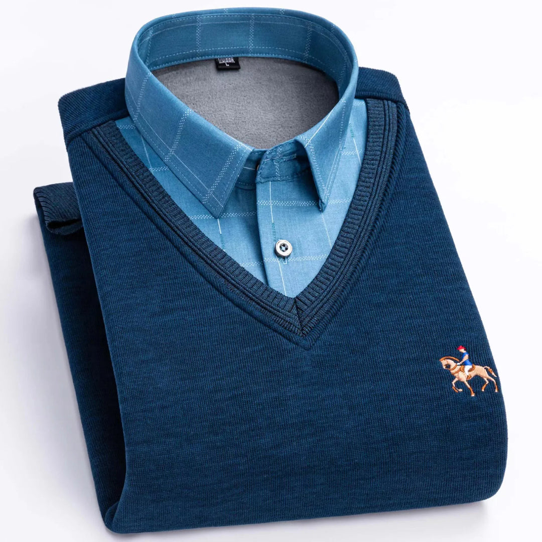 Folded blue V-neck sweater with checked light blue collared shirt and embroidered horse logo
