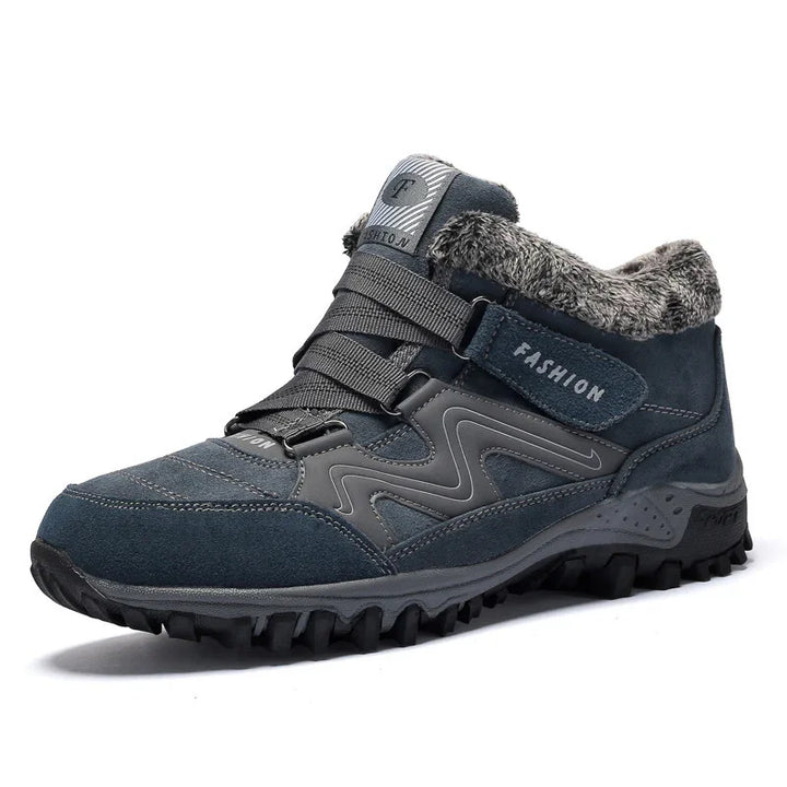 Dark blue winter hiking boot with fur lining, rugged sole, and fashion strap detail
