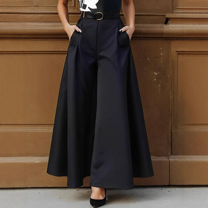 Woman wearing high-waisted black wide-leg pants with belt and black heels