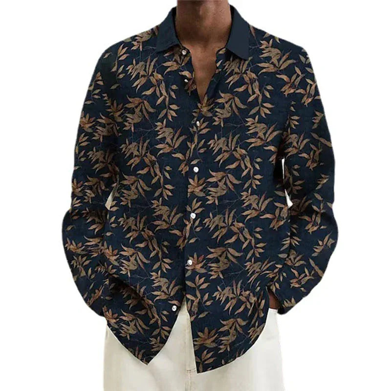men's dark navy button-up shirt with brown leaf print, paired with light beige pants