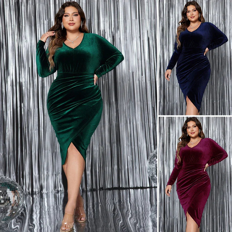 Plus-size model wearing velvet wrap dress in emerald green, navy blue, and burgundy with silver backdrop