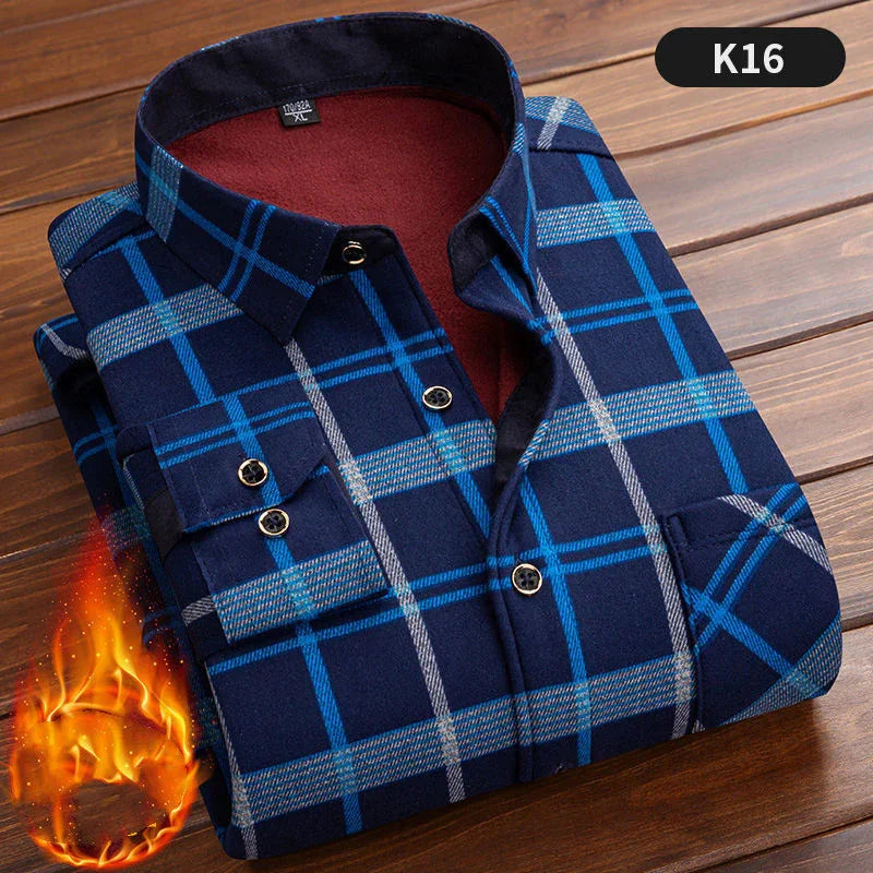 Folded blue and gray plaid flannel shirt with button details on wooden surface