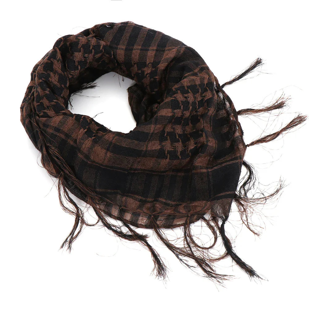 Brown and black checkered shemagh scarf with fringed edges on white background