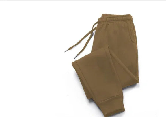 brown casual sweatpants with elastic waistband and drawstrings on white background