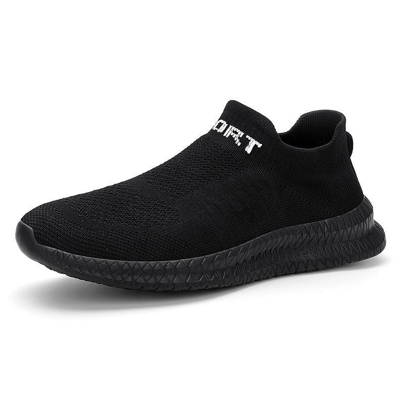 Black slip-on knitted sports shoe with textured sole and white text near ankle