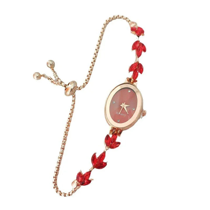Elegant rose gold ladies quartz watch with red leaf accents and adjustable chain bracelet