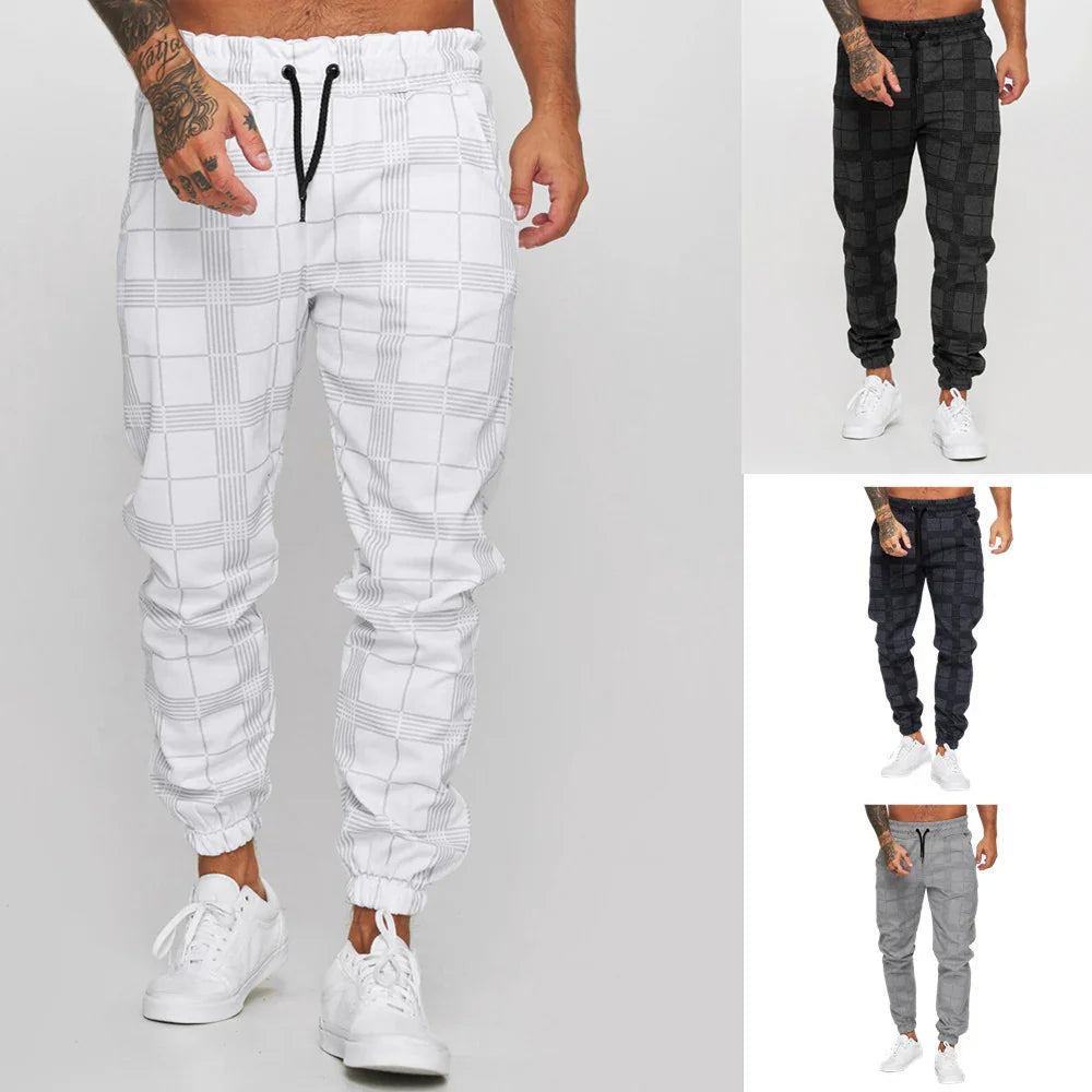 Men's plaid jogger pants in white, black, dark gray, and light gray with elastic cuffs and drawstrings