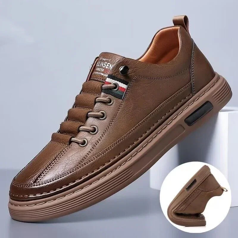 Brown leather casual men's sneaker with flexible sole and red, white, black striped detail