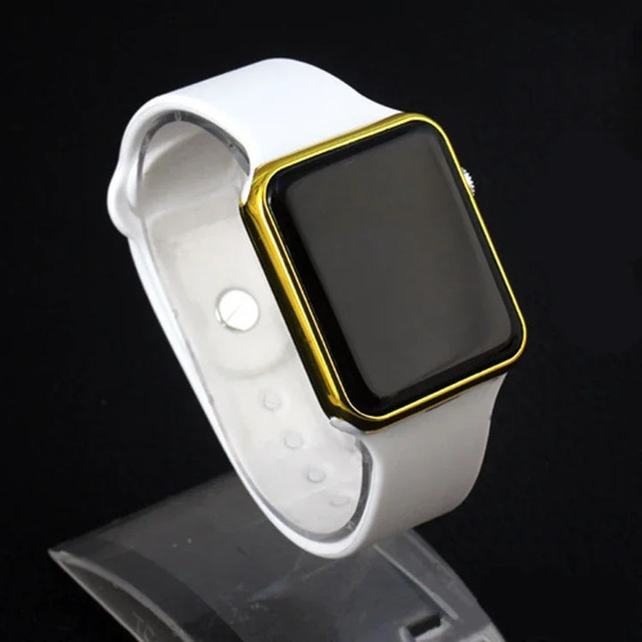smartwatch with gold casing and white silicone strap on display stand against black background