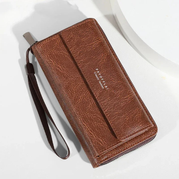 brown leather wristlet wallet with zipper and strap on white surface, PAYOFFLAY Classic Edition text
