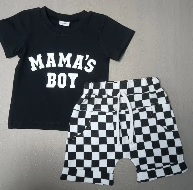 Black toddler t-shirt with 'MAMA'S BOY' text and black-and-white checkered shorts on gray background