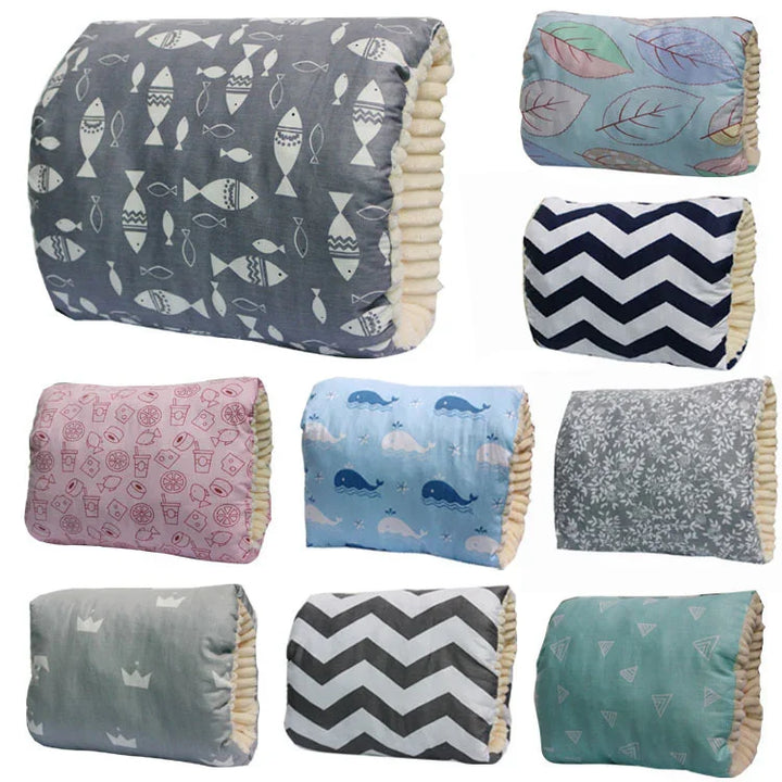 Set of nine assorted patterned pet beds with soft beige interiors, featuring fish, leaves, chevron, whales, and crown designs