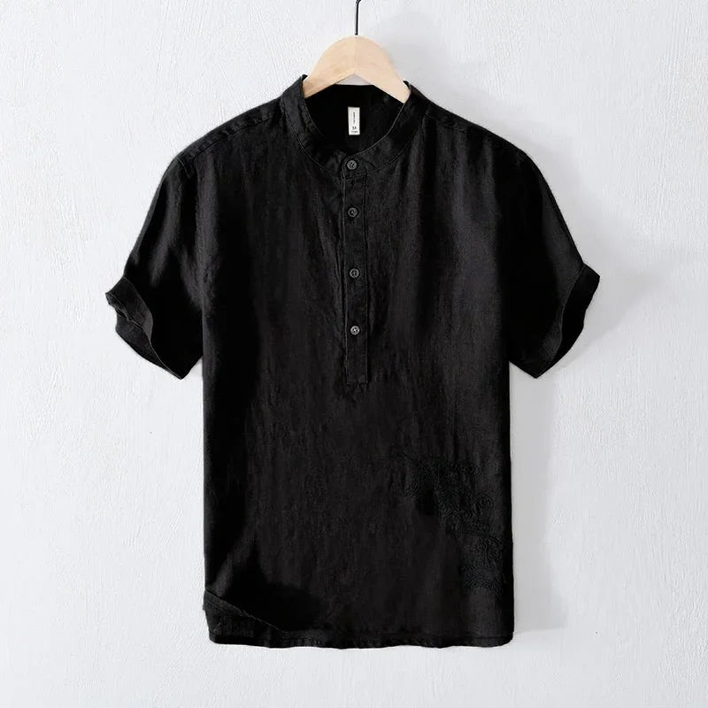 Black short-sleeve henley shirt with mandarin collar hanging on wooden hanger