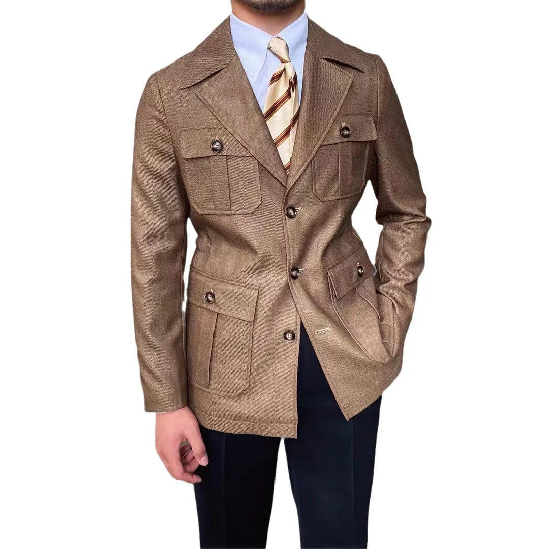 man wearing brown safari jacket with buttoned pockets and striped tie on white background