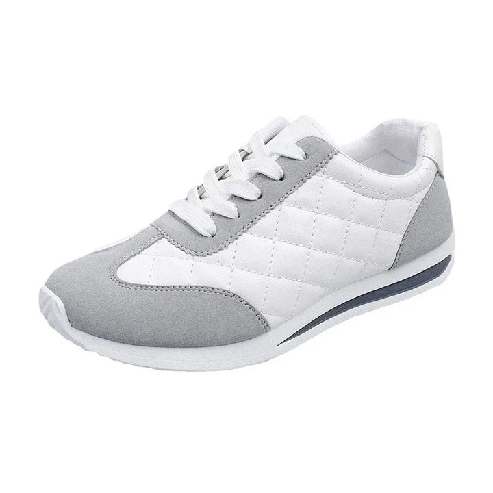 White and gray casual sneaker with quilted side panels and white laces