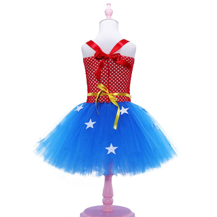 Red and blue tutu dress with white stars, yellow waist ribbon, and red shoulder straps on mannequin