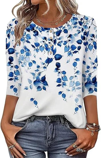 Woman wearing white blouse with blue floral print and three-quarter sleeves, paired with blue jeans
