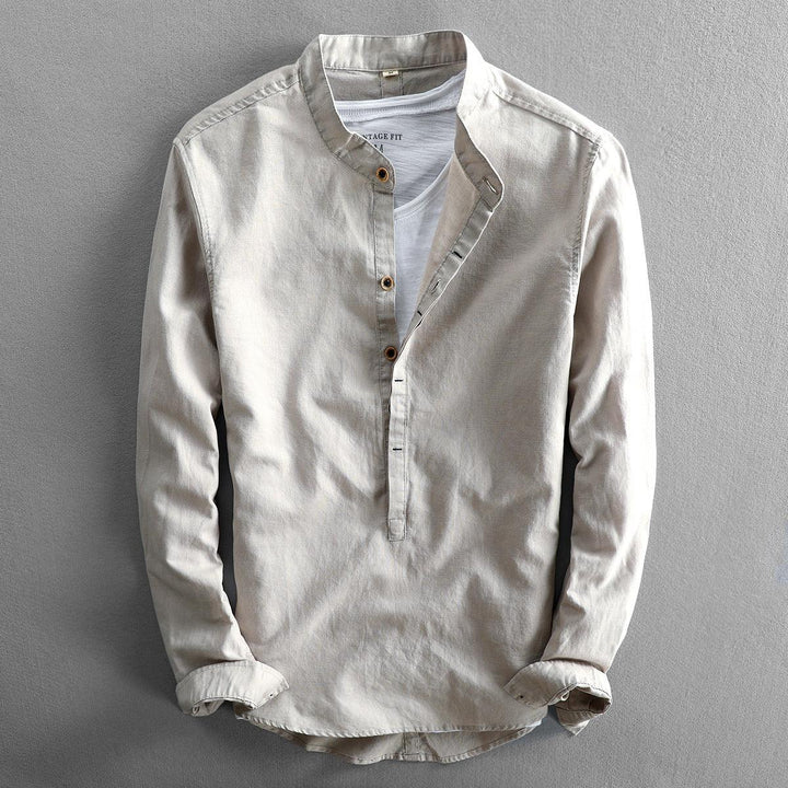 Beige long-sleeve casual shirt with a mandarin collar and button placket on a gray background