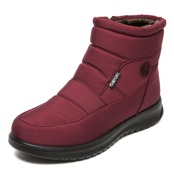 Maroon winter sport boot with padded design, black sole, and fur lining on white background