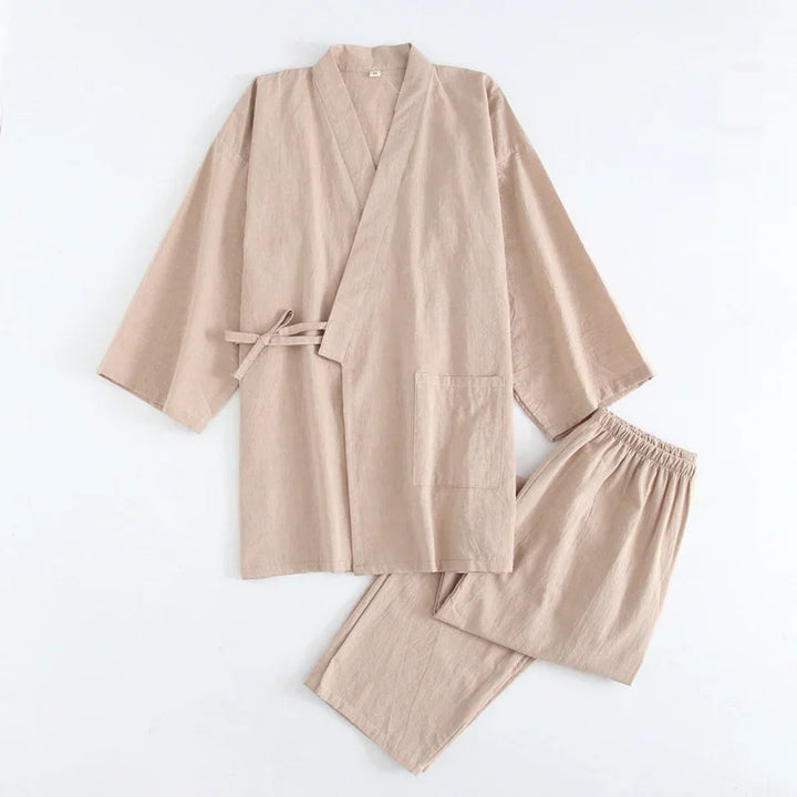 Beige cotton kimono-style top with side ties and pocket paired with elastic waist pants on white background