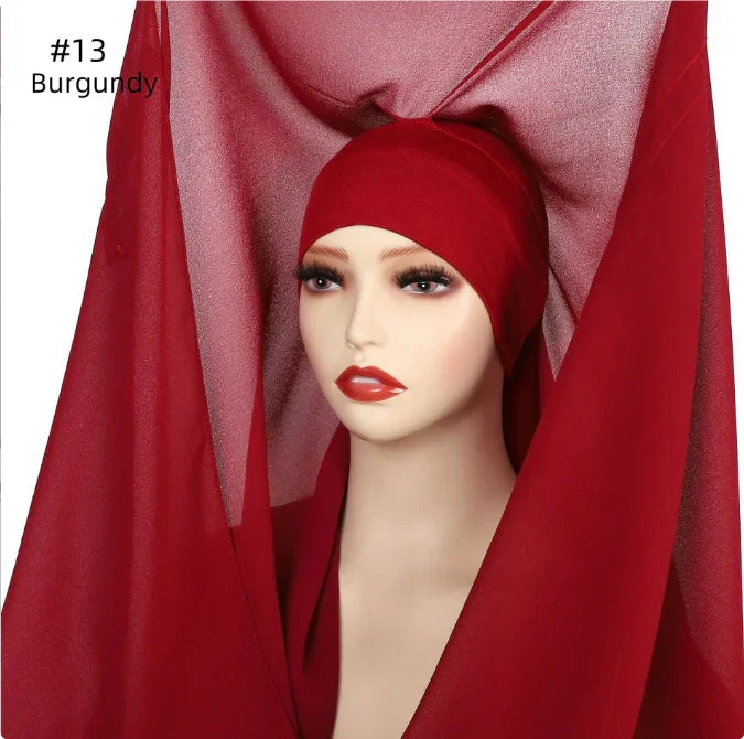 Mannequin wearing burgundy hijab scarf with matching fabric draped around, labeled #13 Burgundy