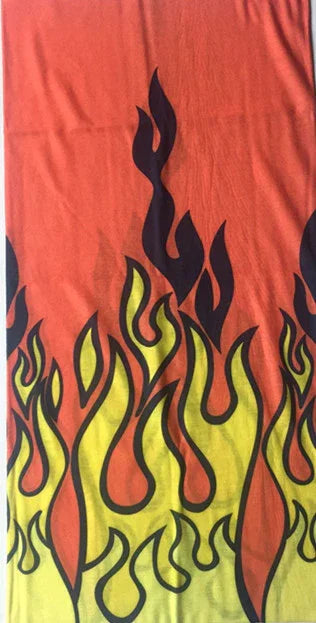 Orange and yellow flame pattern with black outlines on fabric or textile background