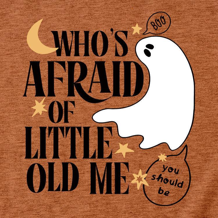 Halloween design with a ghost saying 'boo' and text reading 'Who's afraid of little old me' on orange background